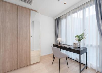 Modern bedroom with desk and wardrobe