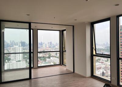 Modern apartment with large glass windows and city view