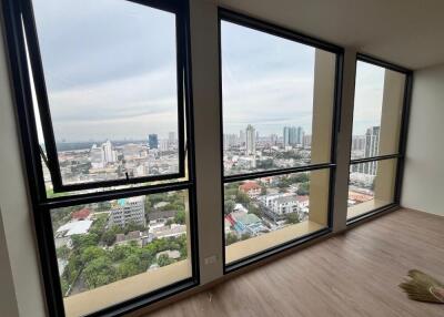 Living room with large windows and city view