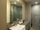 Modern bathroom with large mirror and glass shower