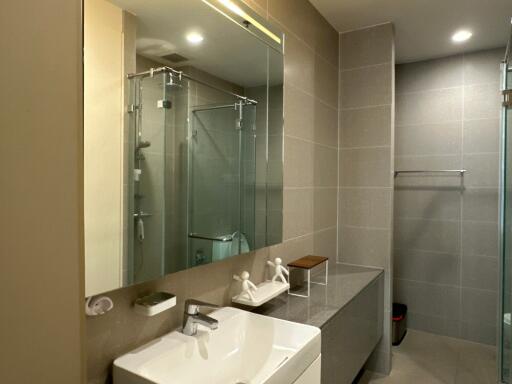 Modern bathroom with large mirror and glass shower