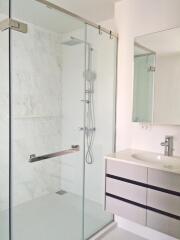 Modern bathroom with walk-in shower and vanity