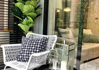 Indoor seating area with modern decor and large windows