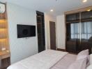 Bedroom with modern interior, featuring wardrobe and shelves