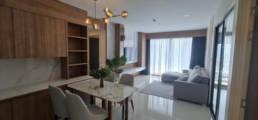 Modern living area with dining table and lounge space