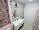 Bathroom with floral wallpaper and modern fixtures