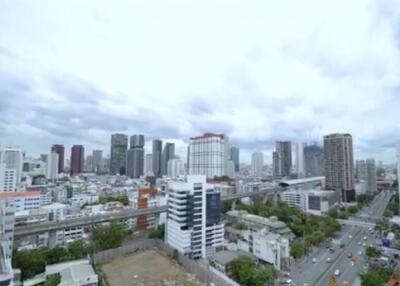 Skyline view of a city with multiple buildings and roads