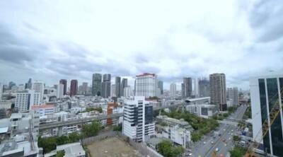 Skyline view of a city with multiple buildings and roads