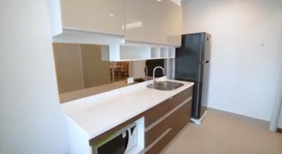 Modern kitchen with white countertop and built-in appliances