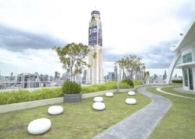 High-rise building with a landscaped terrace offering city views