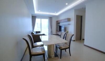 Modern living-dining area with a marble table and chairs