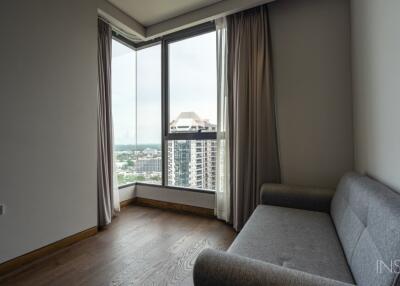 Living area with large windows and city view