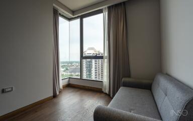 Living area with large windows and city view