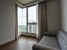 Living area with large windows and city view