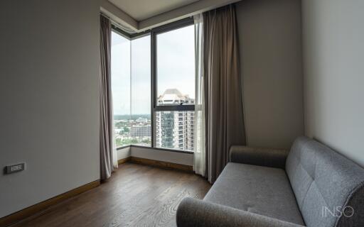 Living area with large windows and city view