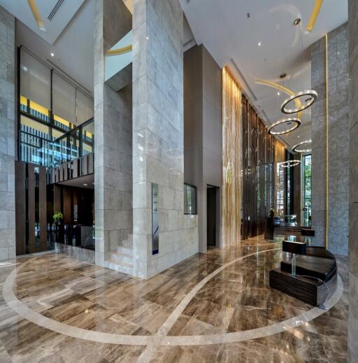 Modern building lobby with high ceilings and marble floors