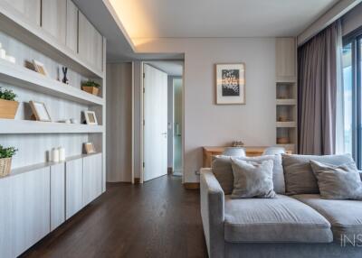 Modern living room with built-in shelves and large windows