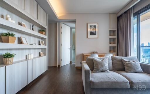 Modern living room with built-in shelves and large windows