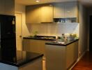 Modern kitchen with black countertops and sleek cabinetry