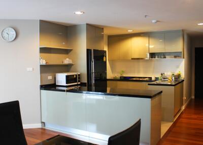 Modern kitchen with appliances and wooden flooring