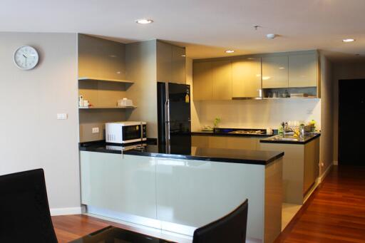 Modern kitchen with appliances and wooden flooring