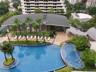 Aerial view of a residential building with a swimming pool