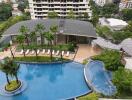 Aerial view of a residential building with a swimming pool