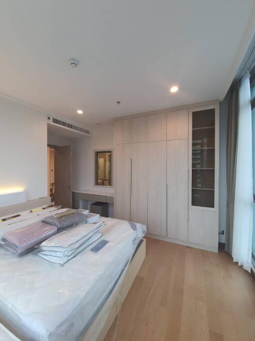 Modern bedroom with bed, wardrobes, and dressing table