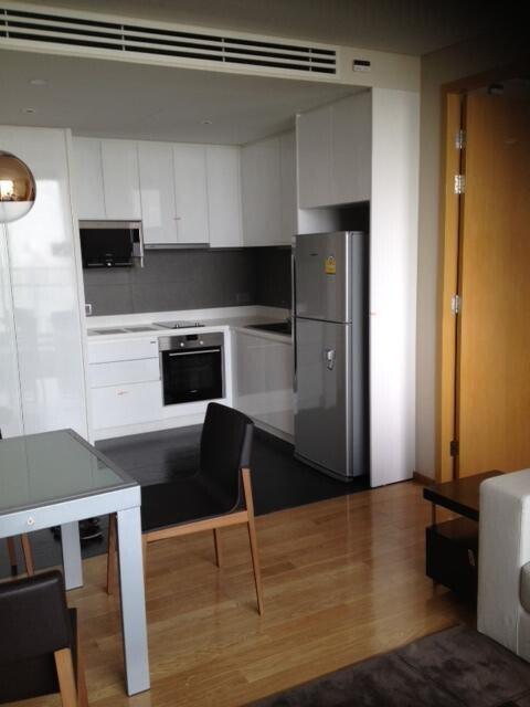 Modern kitchen with white cabinets and stainless steel appliances