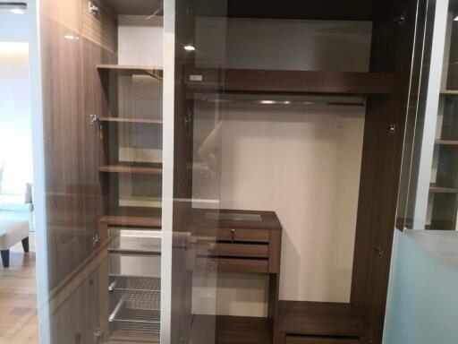 Spacious closet with multiple shelves and hanging space