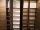 Spacious wooden closet with multiple shelves