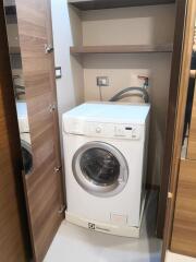 Washing machine in compact laundry space