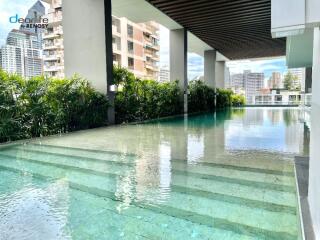 Outdoor swimming pool with cityscape view