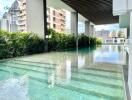 Outdoor swimming pool with cityscape view