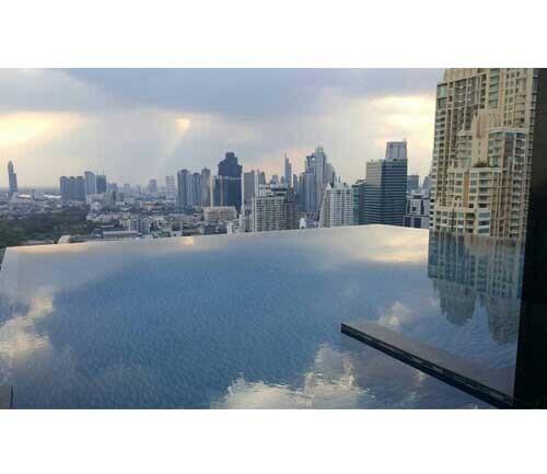 Rooftop infinity pool with city skyline view