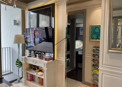 Living room with built-in TV and shelving