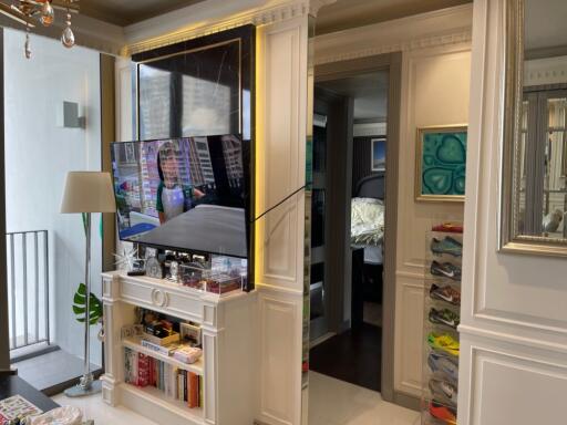 Living room with built-in TV and shelving