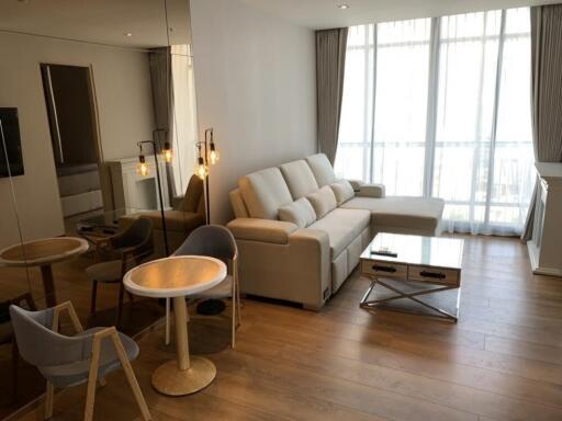 Modern living room with sectional sofa, table and chairs