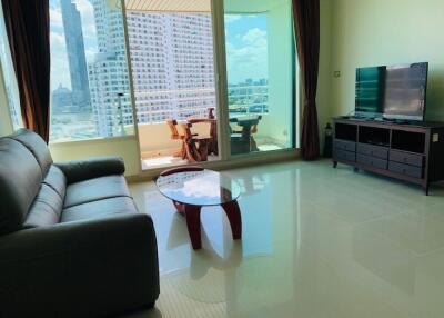 Living room with a large window and balcony view