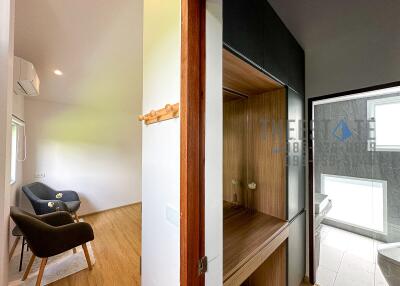 Modern interior view showing a cozy seating area and a sleek bathroom