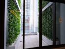 Balcony with green foliage and city view