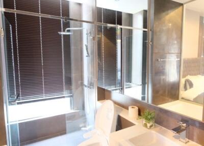 Modern bathroom with glass shower and toilet