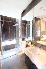 Modern bathroom with glass shower and toilet