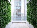 Modern balcony with vertical garden and city view