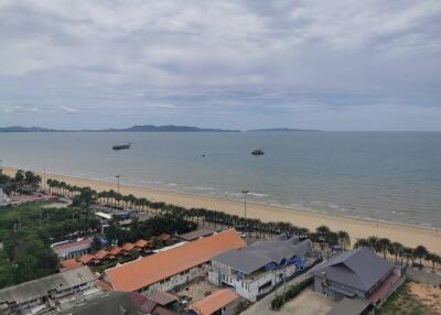 View of the beach with buildings in the foreground and ocean in the background