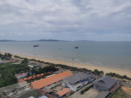 View of the beach with buildings in the foreground and ocean in the background