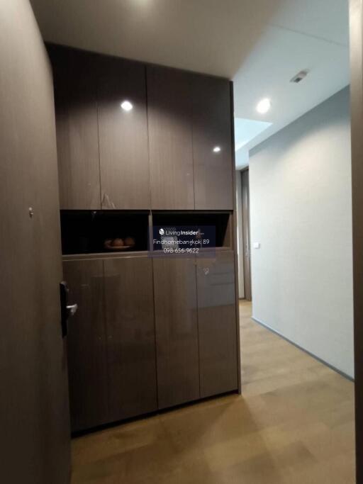 Modern hallway with built-in storage cabinets