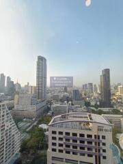 City skyline with multiple high-rise buildings and clear sky