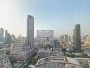 City skyline with multiple high-rise buildings and clear sky