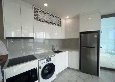 Modern kitchen with white cabinetry and appliances